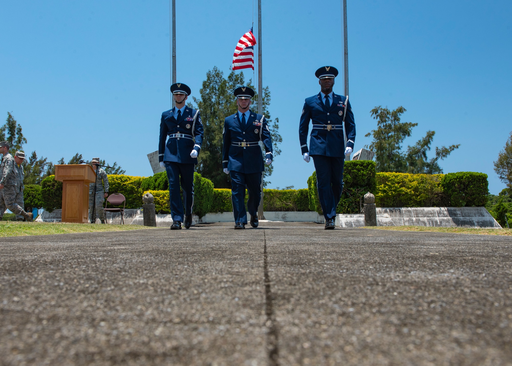 Kadena Air Base honor guardsmen march after posting the American flag at half-staff during a Memorial Day ceremony May 25, 2018, at Kadena Air Base, Japan. The American flag was posted at half-staff to honor U.S. service members who gave their lives in support of their country. (U.S. Air Force photo by Staff Sgt. Micaiah Anthony)