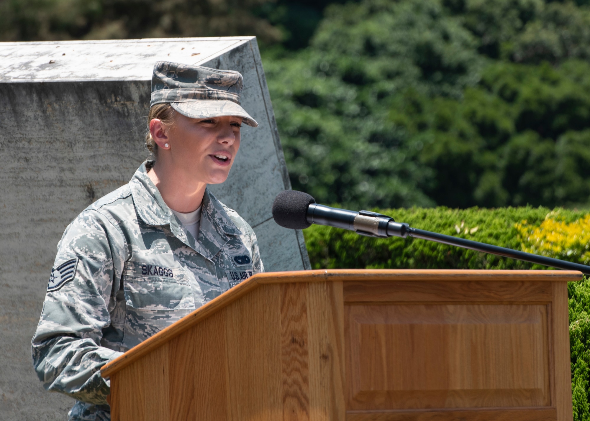 U.S. Air Force Staff Sgt. Chelsea Skaggs, 18th Logistics Readiness Squadron Travel Management Office passenger travel supervisor, gives open remarks during a Memorial Day ceremony May 25, 2018, at Kadena Air Base, Japan. Members of Team Kadena gathered to remember and honor U.S. service members who paid the ultimate sacrifice for their country. (U.S. Air Force photo by Staff Sgt. Micaiah Anthony)