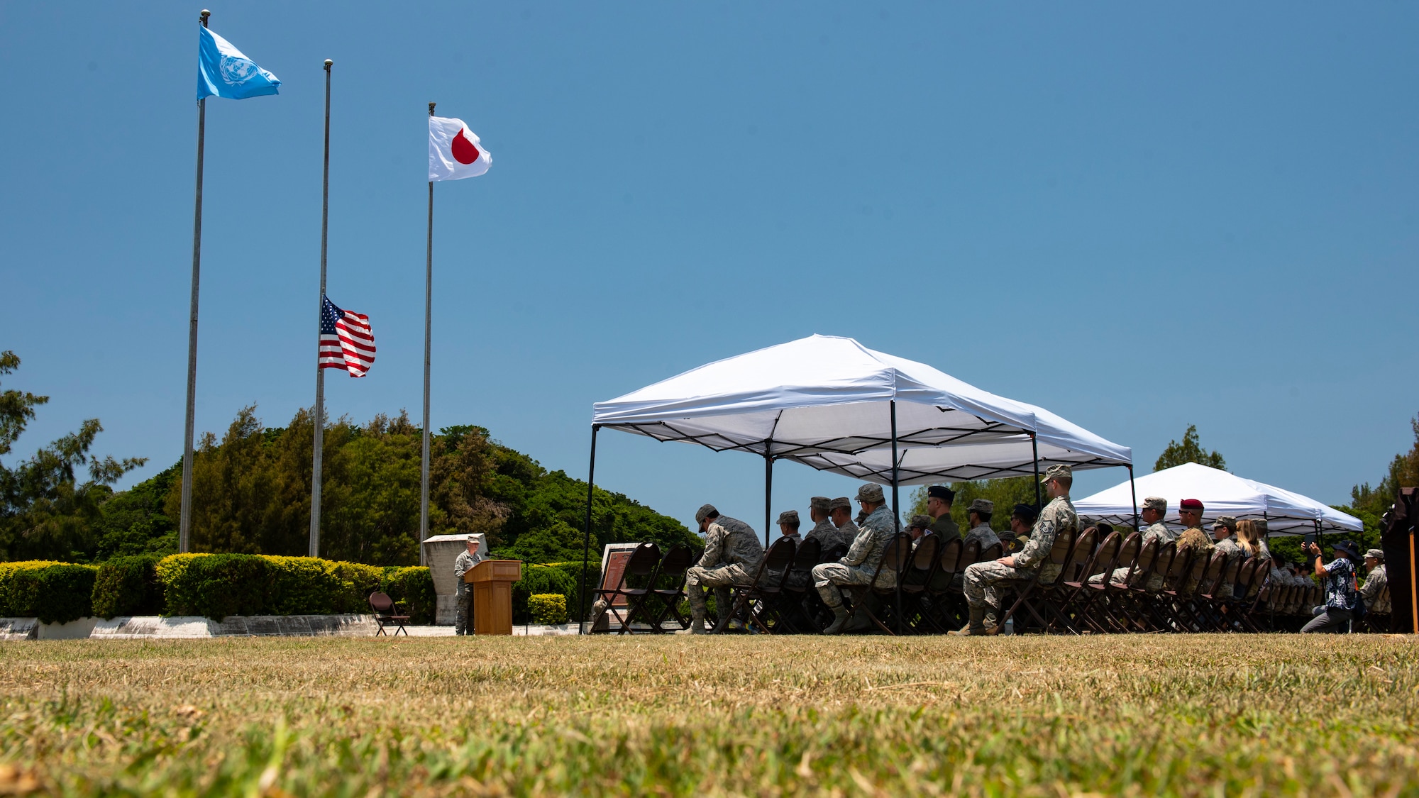 Members of Team Kadena honor the fallen during a Memorial Day ceremony May 25, 2018, at Kadena Air Base, Japan.  Each year Memorial Day is held the last Monday of May to honor U.S. service members who paid the ultimate sacrifice for their country. (U.S. Air Force photo by Staff Sgt. Micaiah Anthony)
