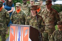 Soldier speaking at podium