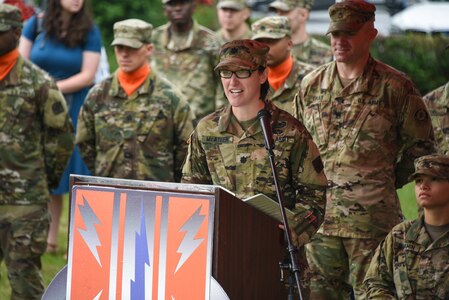 Soldier speaking at podium