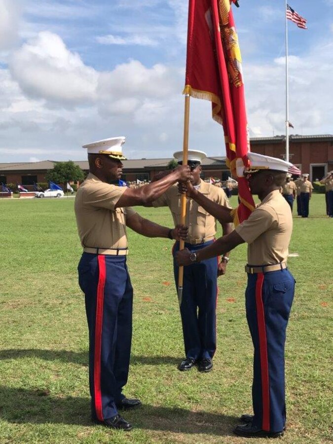 In an hour-long change of command ceremony on Schmid Field, Col. James C. Carroll III, outgoing commanding officer, Marine Corps Logistics Base Albany, relinquished command to Col. Alphonso Trimble, incoming commanding officer, May 24.