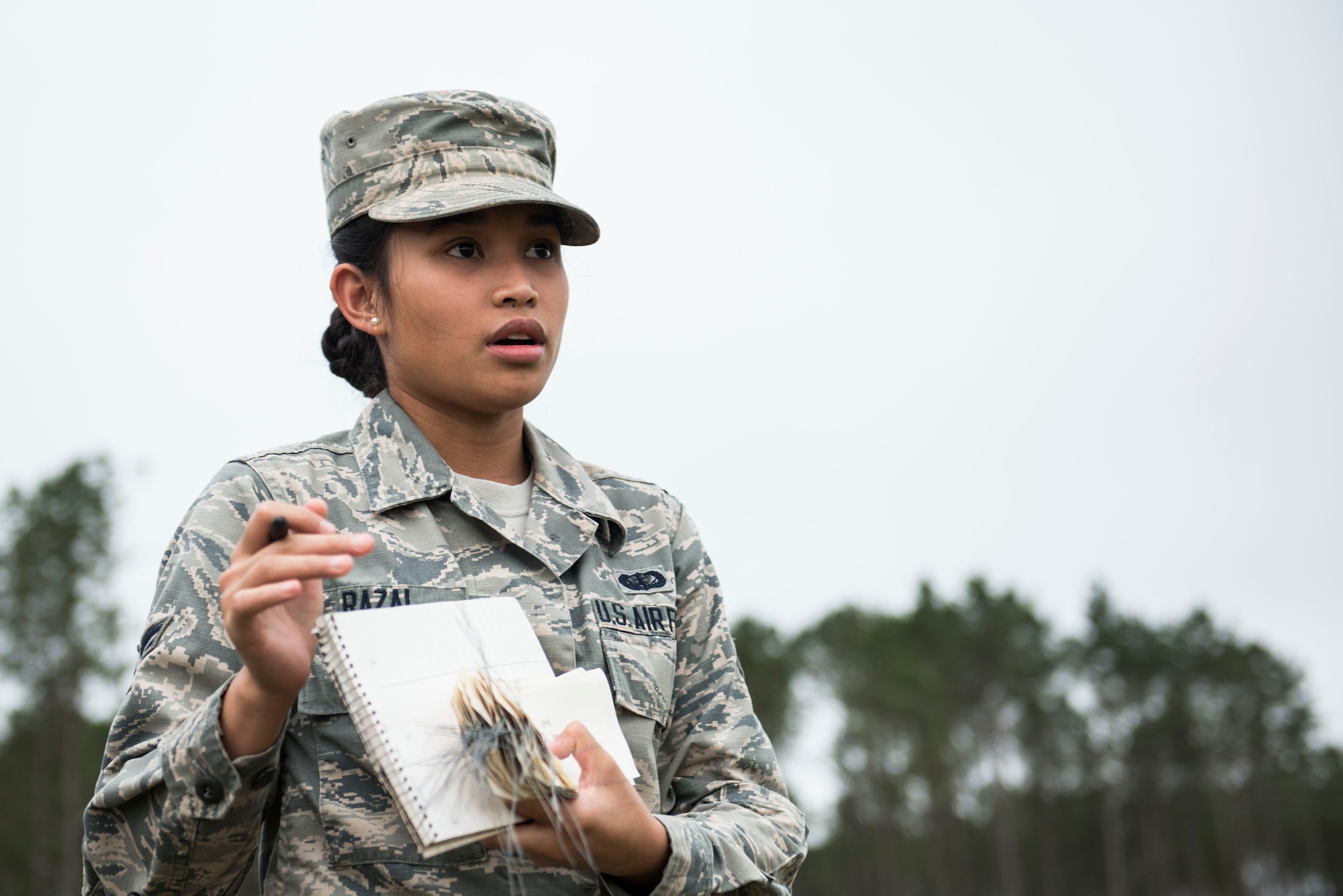 A U.S. Airman assigned to the 20th Force Support Squadron explains how search and recovery tags work prior to an exercise at Shaw Air Force Base, S.C., May 23, 2018.