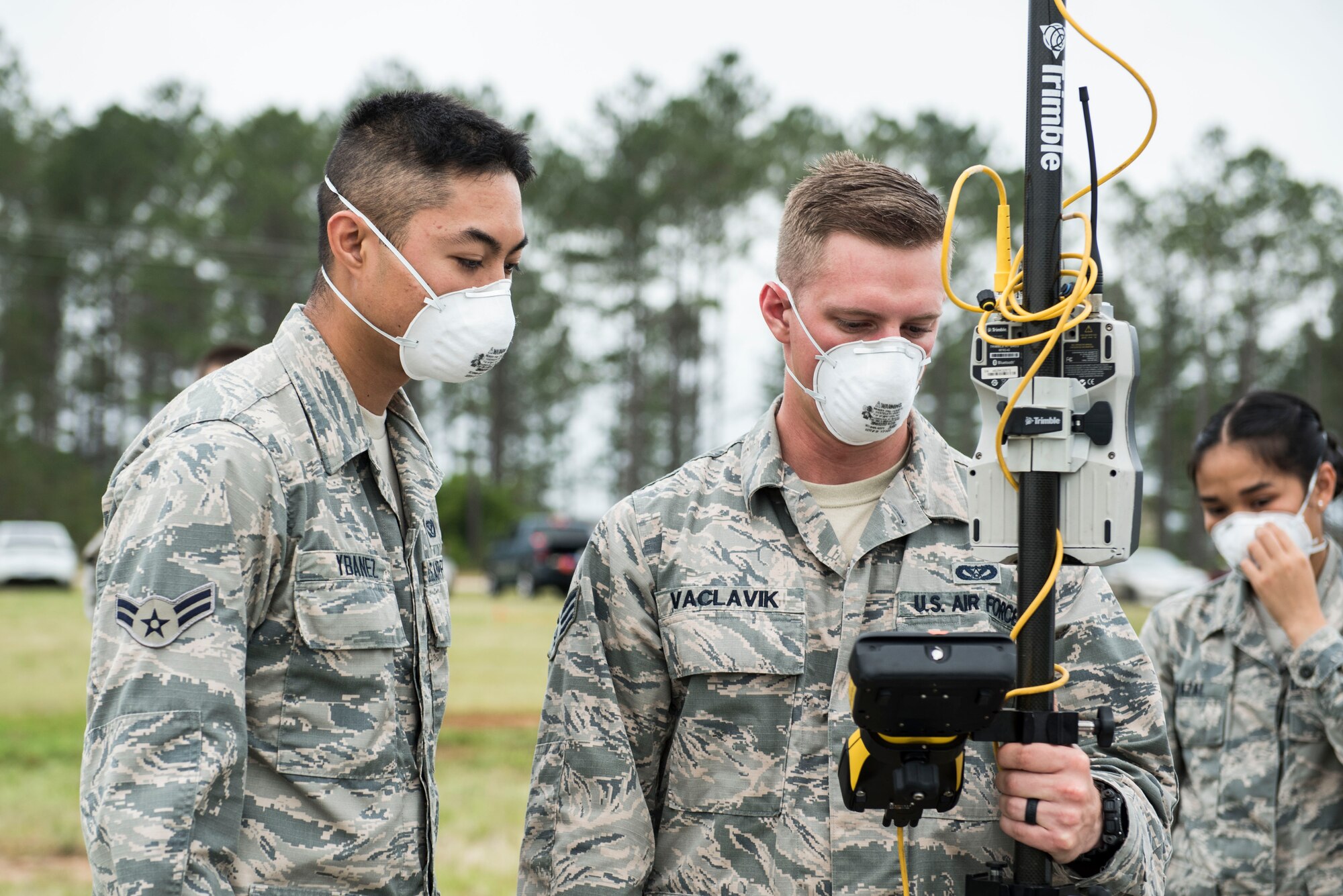 U.S. Airmen assigned to the 20th Civil Engineer Squadron mark the coordinates of a found object during a search and recovery exercise at Shaw Air Force Base, S.C., May 23, 2018.