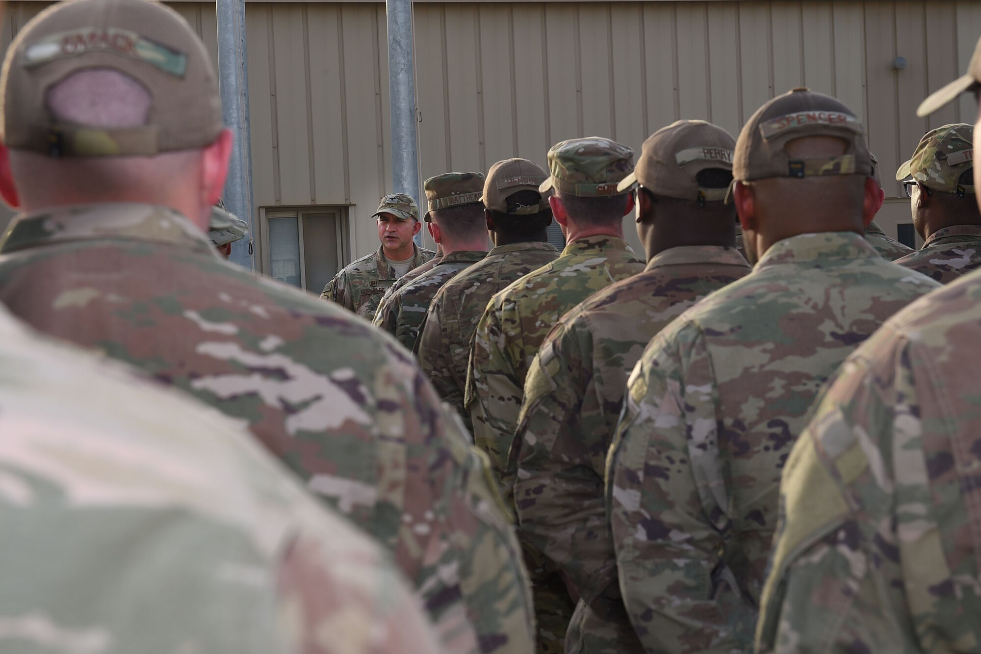 Col. John Gonzales, 407th Air Expeditionary Group commander, speaks to the men and women of the 407th AEG during a Memorial Day retreat ceremony, May 28, 2018.