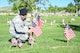 Airman 1st Class Jose Rosales-Nunez, 75th Security Forces, places a flag May 26,2018, at the Veterans Memorial Cemetery at Camp Williams, Utah. Several Airmen from Hill Air Force Base participated in the annual flag laying event over Memorial Day weekend. (U.S Air Force photo by Cynthia Griggs)