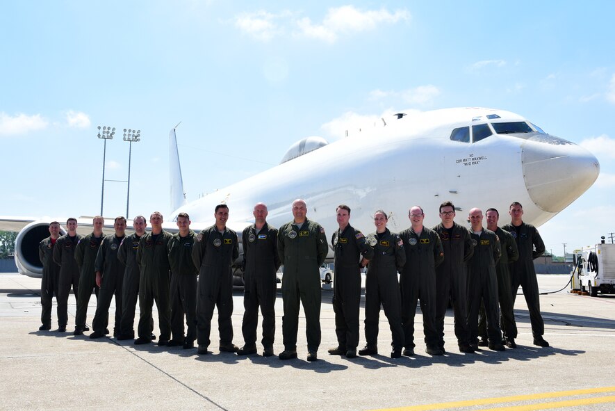 Members of U.S. Strategic Command and the 625th Strategic Operations Squadron stand on the flight line at Offutt Air Force Base, Nebraska, in front of a U.S. Navy E-6B after having pulled a successful alert May 21, 2018. The entire crew worked together to ensure the U.S. was defended in the instance of a strategic attack against the nation. (U.S. Air Force photo by Staff Sgt. Rachel Hammes)