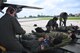 932nd Aeromedical Evacuation Squadron medical members make final arrangements to carry a litter, as they work together with ground crew, preparing to fly with "simulated patients" during a training flight, May 19, 2018 at Scott Air Force Base, Ill. The AES trained alongside fellow nurses and medical technicians on a multi day flight aboard a C-130 aircraft visiting from the 910th Airlift Wing of Youngstown, Ohio. The 932nd Airlift Wing is a 22nd Air Force unit, under the Air Force Reserve Command, and is located at Scott Air Force Base, Ill.  (U.S. Air Force photos by Lt. Col. Stan Paregien)