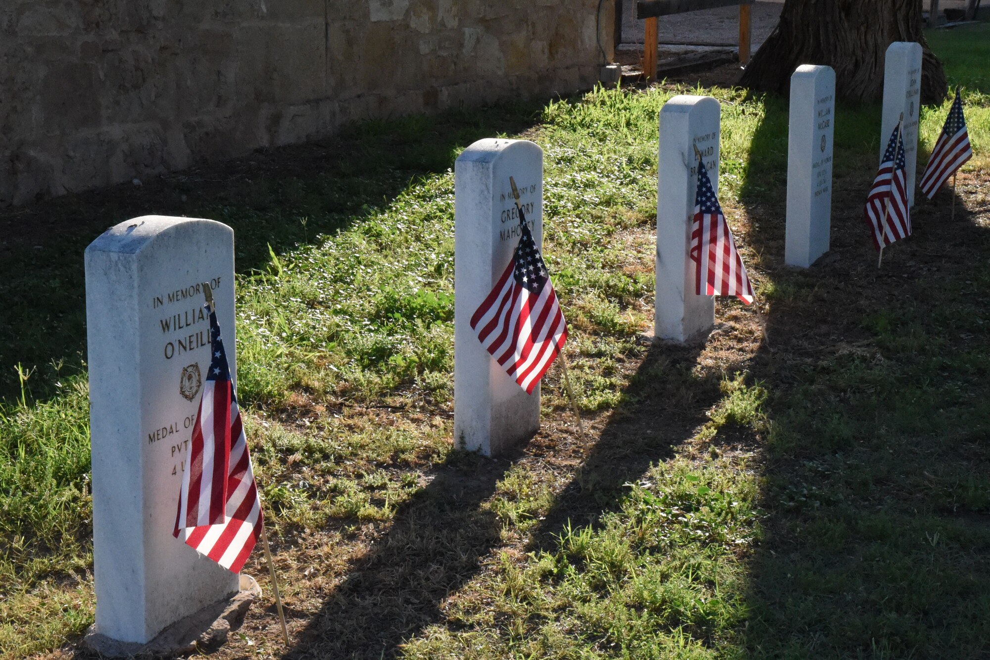 Flags honoring veteran’s at graves at Old Fort Concho during Memorial Day in San Angelo, Texas, May 28, 2018. Memorial Day is set aside for individuals to remember military members who have fallen for their country during times of war. (U.S. Air Force photo by Airman 1st Class Seraiah Hines/Released)