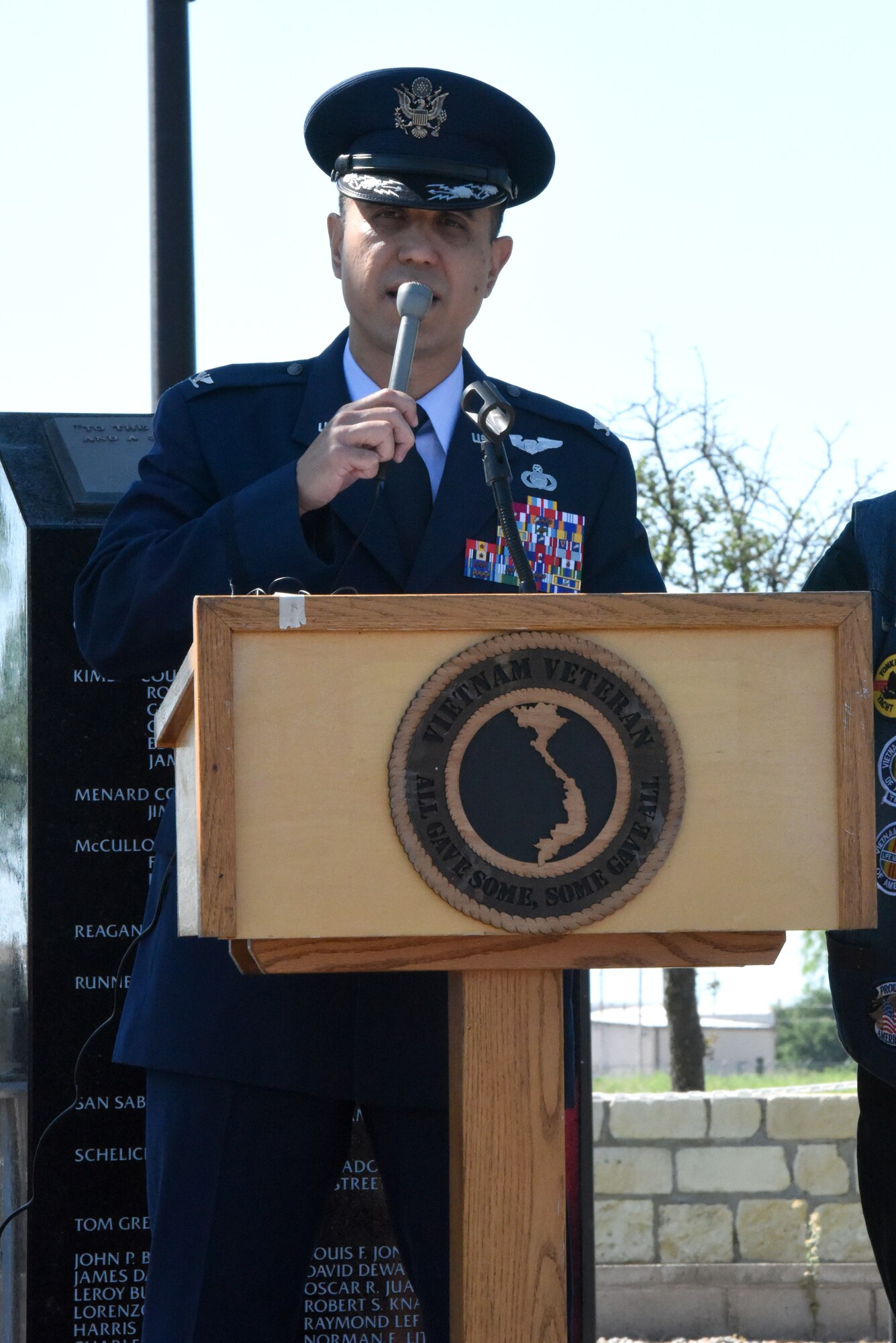 U.S. Air Force Col. Ricky Mills, 17th Training Wing commander, speaks during the Memorial Day Ceremony held at the Vietnam Memorial near Mathis Field in San Angelo, Texas, May 28, 2018. Mills reminisced about his time serving alongside America’s allies, and how they always honored fallen American military members. (U.S. Air Force photo by Airman 1st Class Seraiah Hines/Released)