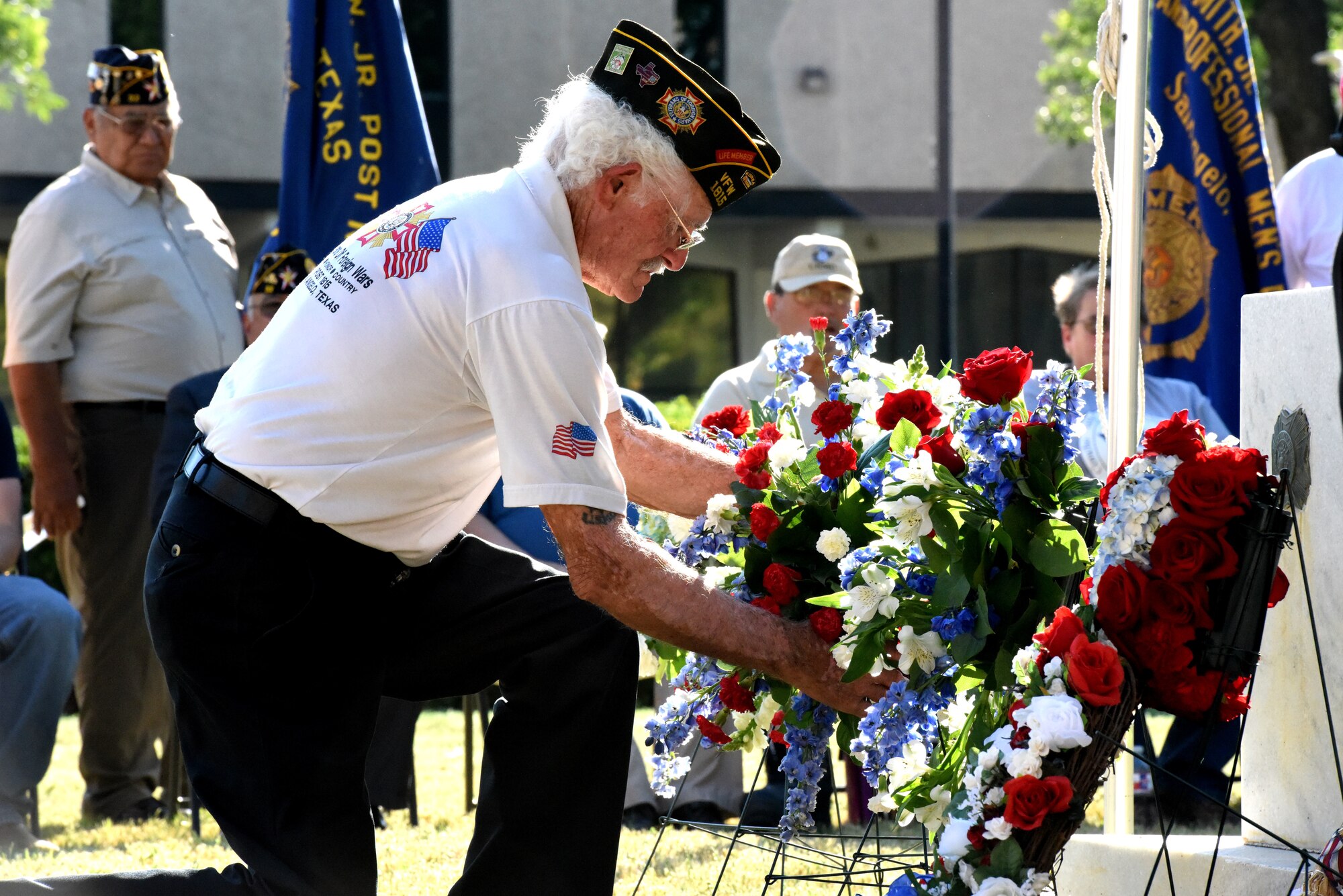 Members of the All Veterans Council of Tom Green County lay wreaths at the memorial in front of the Tom Green County Courthouse during the Memorial Day Commemoration in San Angelo, Texas, May 28, 2018. During the ceremony, U.S. Army Lt. Col. Yukio Kuniyuki, 344th Military Intelligence Battalion commander, spoke about the tradition of honoring fallen warriors. (U.S. Air Force photo by Airman 1st Class Seraiah Hines/Released)