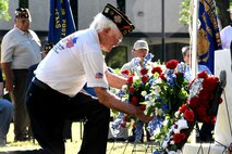 Members of the All Veterans Council of Tom Green County lay wreaths at the memorial in front of the Tom Green County Courthouse during the Memorial Day Commemoration in San Angelo, Texas, May 28, 2018. During the ceremony, U.S. Army Lt. Col. Yukio Kuniyuki, 344th Military Intelligence Battalion commander, spoke about the tradition of honoring fallen warriors. (U.S. Air Force photo by Airman 1st Class Seraiah Hines/Released)