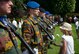 Belgian Soldiers stand at attention while children carry flowers to the graves they guard at Flanders Field American Cemetery, Belgium, May 27, 2018. The children and soldiers participated in a Memorial Day ceremony honoring the service, achievements and sacrifice of U.S. Armed Forces and their allies.