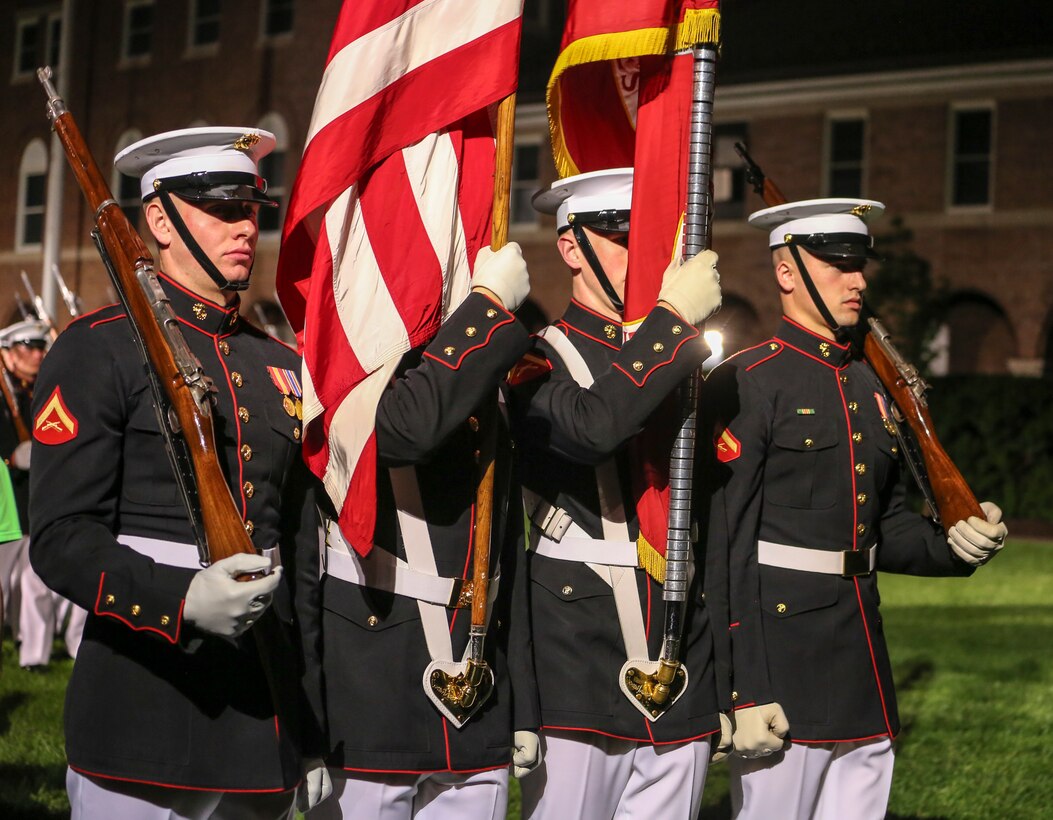 Marines with the U.S. Marine Corps Color Guard conduct pass in review during a Friday Evening Parade at Marine Barracks Washington D.C., May 25, 2018. The guests of honor for the parade were Gold Star Families and the hosting official was Lieutenant Gen. Robert S. Walsh, commanding general, Marine Corps Combat Development Command, and deputy commandant, Combat Development and Integration. (Official Marine Corps photo by Cpl. Damon Mclean/Released)