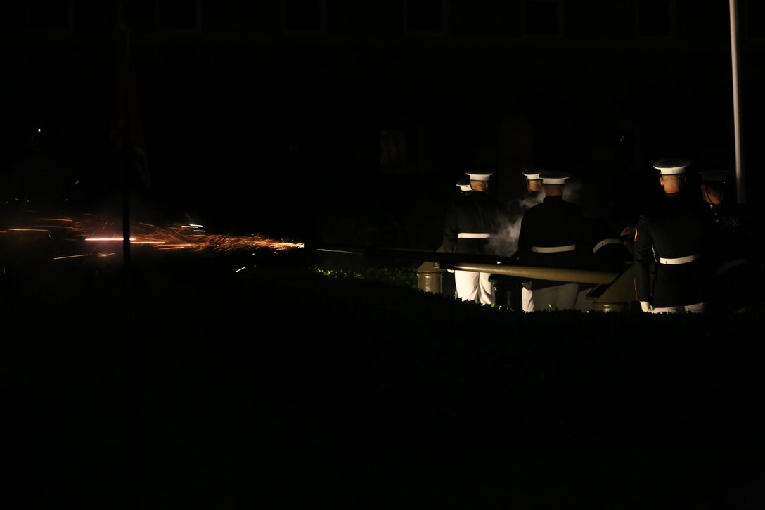 Marine Corps Body Bearers, Bravo Company, Marine Barracks Washington D.C., fire a cannon volley to render honors during a Friday Evening Parade at the Barracks, May 25, 2018. The guests of honor for the parade were Gold Star Families and the hosting official was Lieutenant Gen. Robert S Walsh, commanding general, Marine Corps Combat Development Command, and deputy commandant, Combat Development at Integration. (Official photo by Marine Corps Pfc. James Bourgeois/Released)