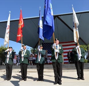 Members of the Special Forces Association, Chapter XV, present the service flags of each military branch as each service's song is played by the 323rd Army Band "Fort Sam's Own" during the Memorial Day ceremony at the Fort Sam Houston National Cemetery amphitheater May 28.