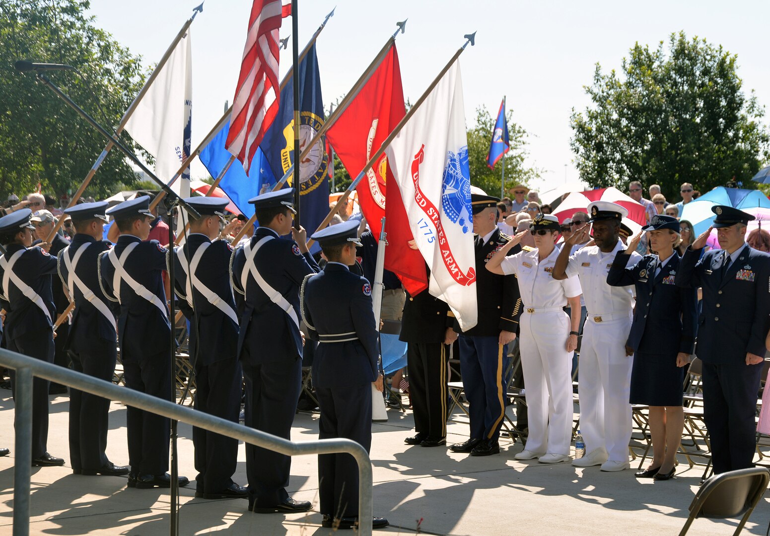 Members of the Southside High School Junior Air Force ROTC Honor Guard present the colors as local military leaders salute during the Memorial Day ceremony at the Fort Sam Houston National Cemetery amphitheater May 28.