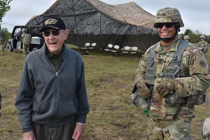 WWII veteran Charlie Brown, who served with the 258th Field Artillery, arrives on in the training site of Fort Drum, Watertown, N.Y., May 23, 2018. Brown was a guest of the 258 during their annual training, and would be pulling the lanyard on the first M777 howitzer to fire.