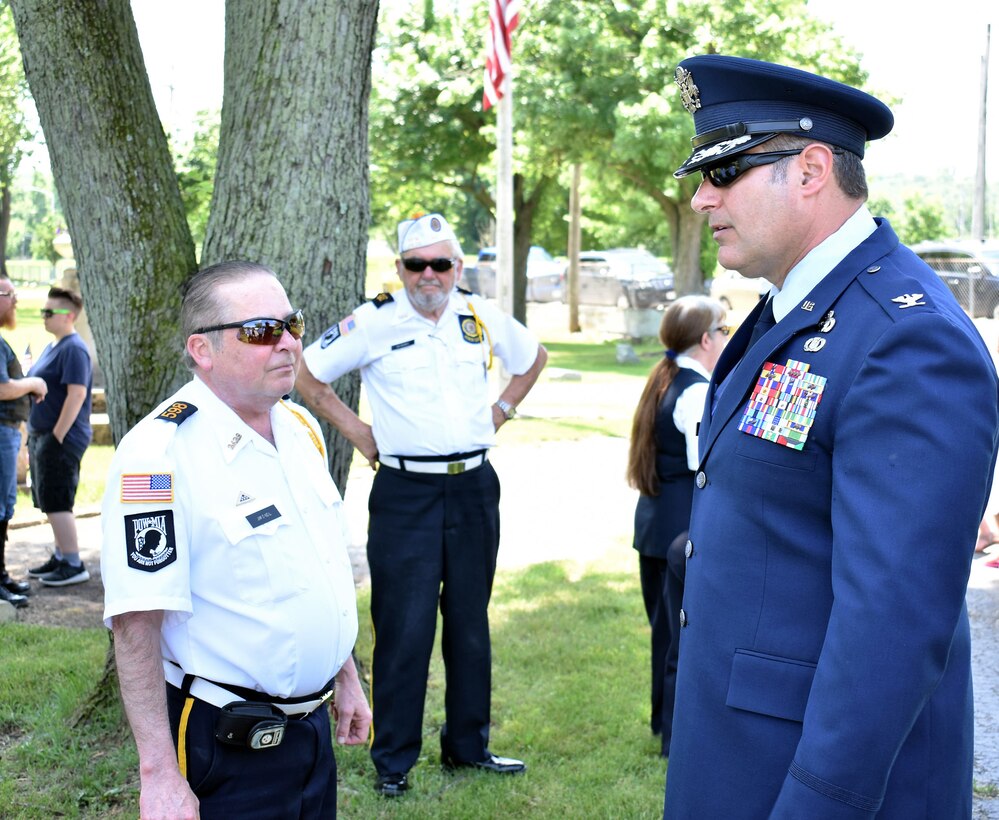 655th Intelligence, Surveillance and Reconnaissance Group Commander John D. McKaye speaks with American Legion Post 598 Honor Guard members before a Memorial Day observance ceremony at Evergreen Cemetery, West Carrollton, Ohio, May 27, 2018