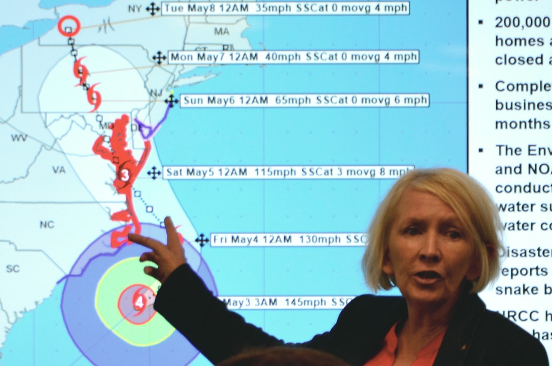 Dorothy O’Connell, DLA Troop Support Customer Operations, updates employees on the status of the simulated “Hurricane Cora” during a humanitarian relief and disaster recovery tabletop exercise May 22 in Philadelphia.