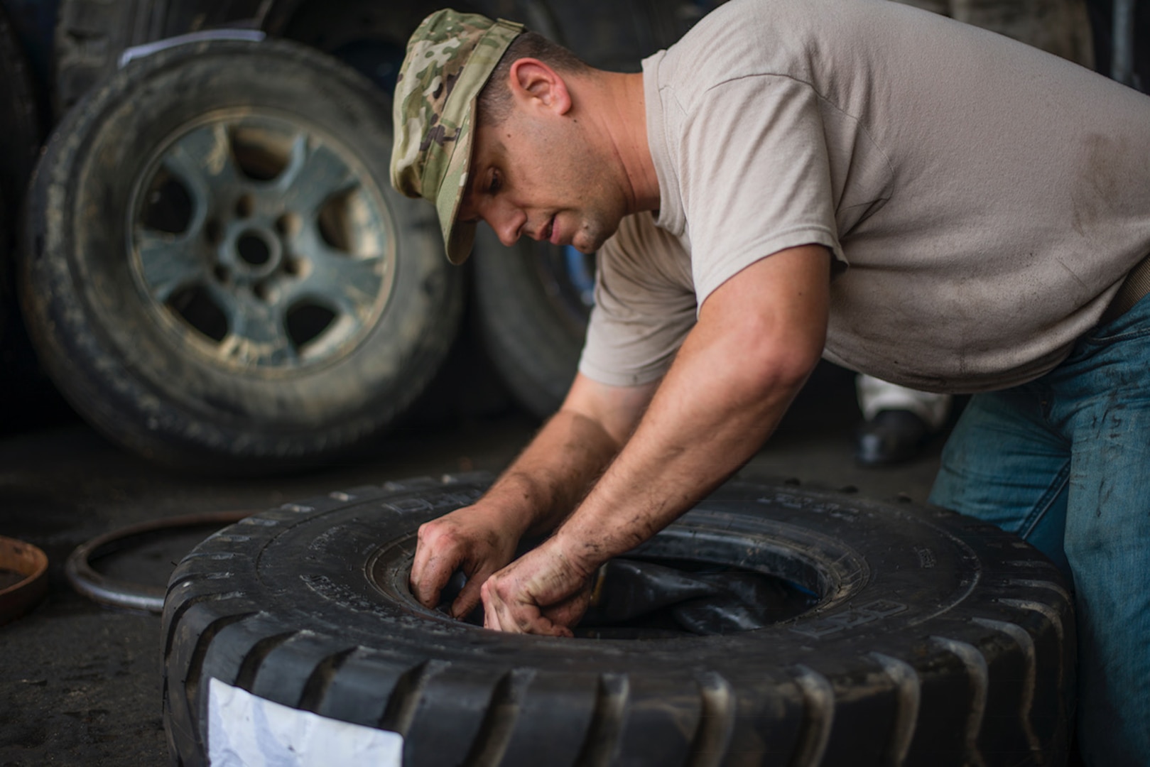Tech. Sgt. Bryant Friend, 571st Air Mobility Advisory Squadron vehicle maintainer, changes the tires on a forklift while conducting training with the Dominican Republic Air Force in the Dominican Republic, May 3. Friend conducted the first U.S. Air Force assessment of FARD vehicle maintenance operations. He helped them make their sole forklift operational after four months out of service and regain their cargo aircraft loading capability. (U.S. Air Force photo by Staff Sgt. Heather Flitcroft)