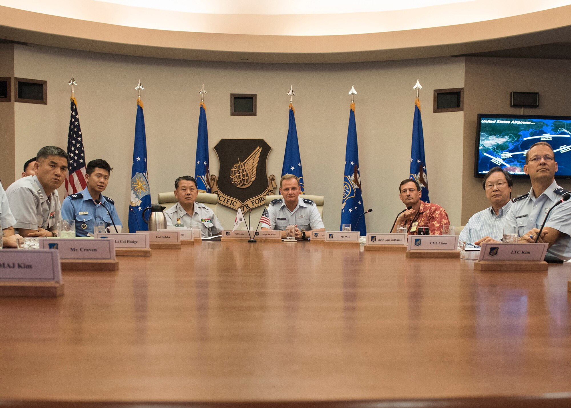 Republic of Korea Army Gen. Byung Joo Kim, Combined Forces Command deputy commander and U.S Air Force Maj. Gen. Russ Mack, Pacific Air Forces (PACAF) deputy commander, receive a briefing at Joint Base Pearl Harbor-Hickam, Hawaii, May 21, 2018.
