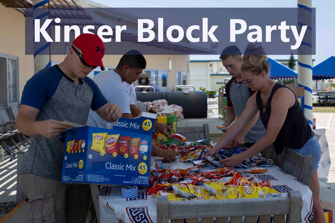 United Service Organizations volunteers set up food for the Kinser Block Party May 25, 2018, at the USO, Camp Kinser, Okinawa, Japan. The Kinser Block Party was directed by U.S. Marine Corps Col. Scott R. Johnson, the camp commander for Camp Kinser, as a way for service members and their families to enjoy a day of fun and camaraderie before embarking on the Memorial Day weekend. During the five-hour event, attendees enjoyed free food, games, live music and a dunk tank. (U.S. Marine Corps photo by Pfc. Terry Wong)