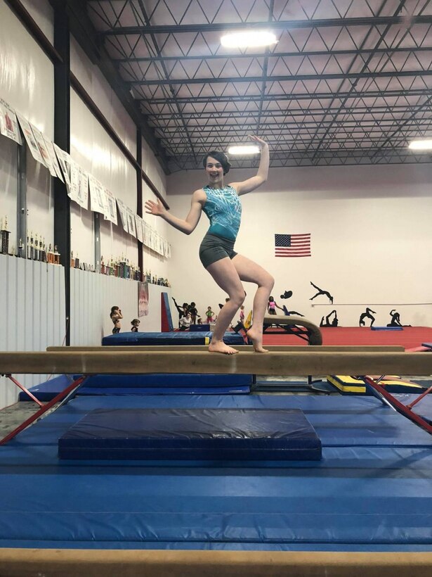 Meghan Fox, a Summer Leadership and Character Development Academy (SLCDA) selectee, poses on a beam in her gymnastics gym, in Hagerstown, Maryland. Meghan is one out of 196 students chosen to attend SLCDA.