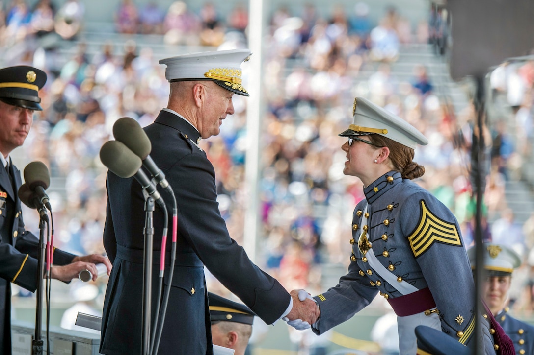 Marine Corps Gen. Joe Dunford shakes hands with a U.S. Military Academy cadet.