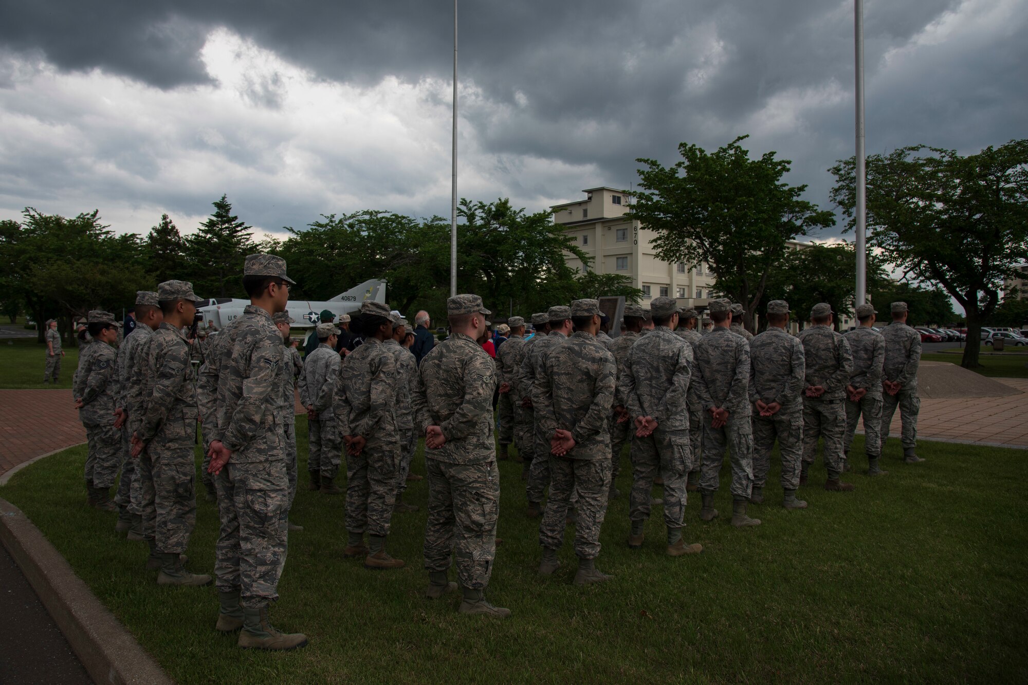 Airmen with the 35th Fighter Wing stand in formation during a Memorial Day ceremony held at Misawa Air Base, Japan, May 25, 2018. Memorial Day was formally observed for the first time May 30, 1868, at Arlington National Cemetry in Arlington, Virginia as a way of honoring those who died during the Civil War. Today, Memorial Day is an opportunity to pause and remember the sacrifices of military personnel who gave the ultimate sacrifice. (U.S. Air Force photo by Airman 1st Class Collette Brooks)