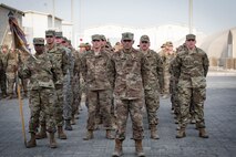 Members deployed to Al Dhafra Air Base stand in formation during a Memorial Day retreat ceremony at the 380th Air Expeditionary Wing headquarters, May 28, 2018. The ceremony honored all fallen service members with a flag retirement ceremony and words from leadership. (U.S. Air Force photo by Staff Sgt. Erica Rodriguez)