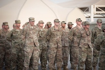 Members deployed to Al Dhafra Air Base stand in formation during a Memorial Day retreat ceremony at the 380th Air Expeditionary Wing headquarters, May 28, 2018. The ceremony honored all fallen service members with a flag retirement ceremony and words from leadership. (U.S. Air Force photo by Staff Sgt. Erica Rodriguez)
