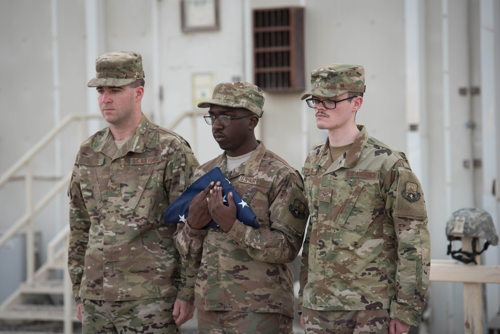 The 380th Air Expeditionary Wing honor guard complete a flag folding during a Memorial Day retreat ceremony at the 380th Air Expeditionary Wing headquarters, May 28, 2018. The ceremony honored all fallen service members with a flag retirement ceremony and words from leadership. (U.S. Air Force photo by Staff Sgt. Erica Rodriguez)