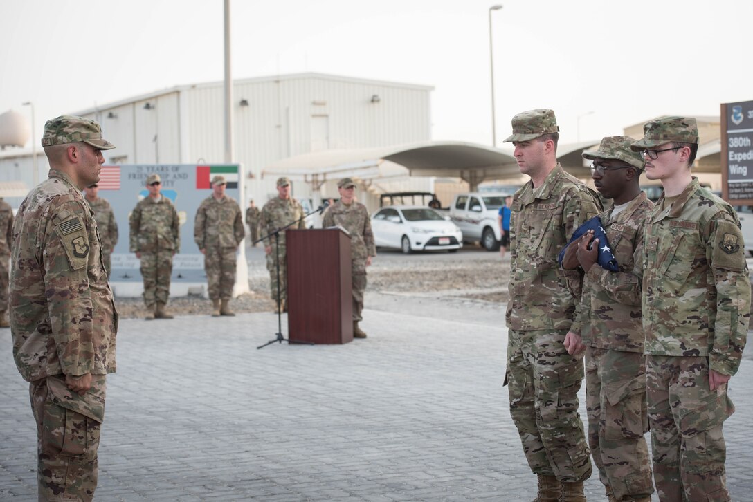 The 380th Air Expeditionary Wing honor guard complete a flag folding during a Memorial Day retreat ceremony at the 380th Air Expeditionary Wing headquarters, May 28, 2018. The ceremony honored all fallen service members with a flag retirement ceremony and words from leadership. (U.S. Air Force photo by Staff Sgt. Erica Rodriguez)