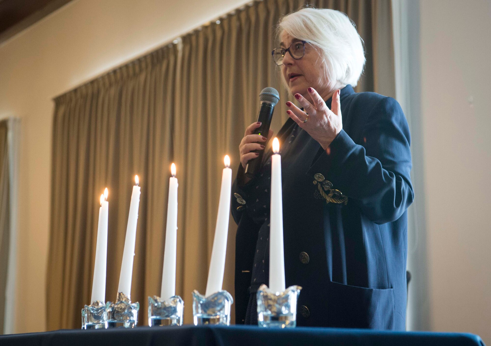 Joan Salter, Holocaust survivor, speaks at the 86th Airlift Wing’s Holocaust Remembrance as an honored guest on Ramstein Air Base, Germany, May 24, 2018. Salter was three months old when Germany invaded her country of residence, Belgium. The 86th AW Holocaust Remembrance honors all who were persecuted in the Holocaust as well as anyone affected by the tragedy, including rescuers and U.S. soldiers who risked their lives during the liberation.  (U.S. Air Force photo by Senior Airman Elizabeth Baker)