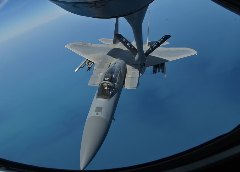 A U.S. Air Force F-15C Eagle from RAF Lakenheath receives fuel from a U.S. Air Force KC-135 Stratotanker from RAF Mildenhall during Exercise Point Blank over England, May 24, 2018. The exercise is a recurring large-force exercise designed and co-hosted by the Royal Air Force and the 48th Fighter Wing. It is a low-cost initiative created to increase tactical proficiency of the Department of Defense and Ministry of Defence forces stationed within the United Kingdom and Europe. (U.S. Air Force photo by Senior Airman Luke Milano)