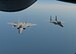 Two U.S. Air Force F-15C Eagles from RAF Lakneheath fly in a formation behind a U.S. Air Force KC-135 Stratotanker from RAF Mildenhall during Exercise Point Blank over England, May 24, 2018. The exercise is a recurring large-force exercise designed and co-hosted by the Royal Air Force and the 48th Fighter Wing. It is a low-cost initiative created to increase tactical proficiency of the Department of Defense and Ministry of Defence forces stationed within the United Kingdom and Europe. (U.S. Air Force photo by Senior Airman Luke Milano)