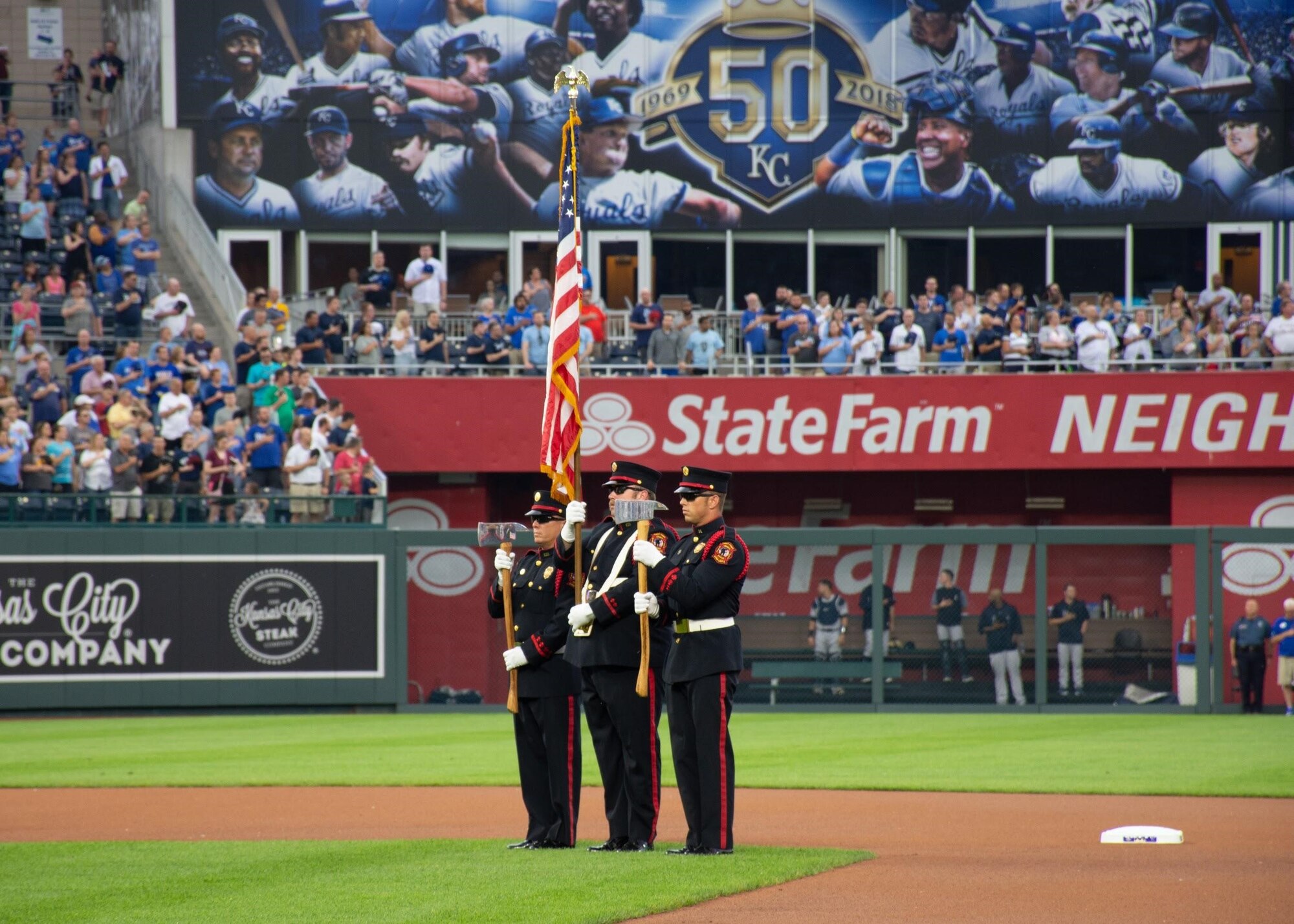 Tech. Sgt. Sean Laffey, armament specialist, assigned to the 442d Fighter Wing, Whiteman Air Force Base, Mo. presents the colors at a Kansas City Royals baseball games May 19, 2018 at Kauffman Stadium, Kansas City, Mo.