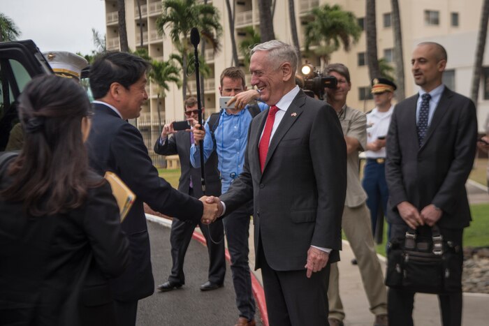 Defense Secretary James N. Mattis shakes hands with the Japanese Defense Minister.