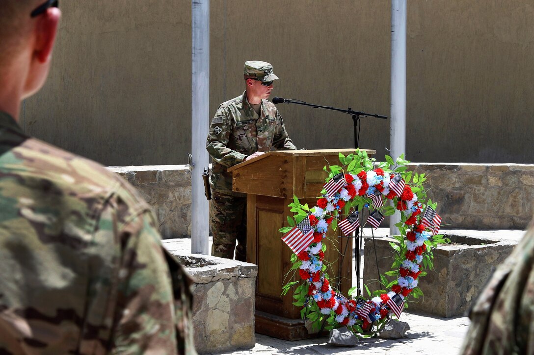 Commander delivers remarks during a Memorial Day remembrance ceremony.