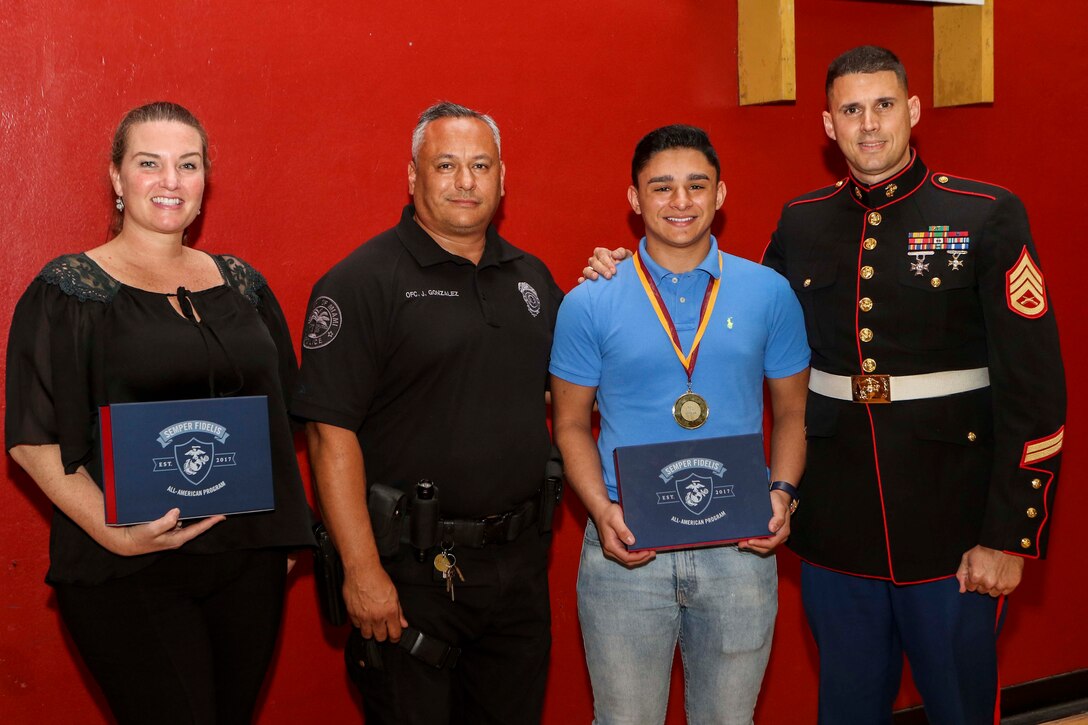 Christian Gonzalez receives the Semper Fidelis All-American Program award at Miami Springs, Florida, May 24, 2018.