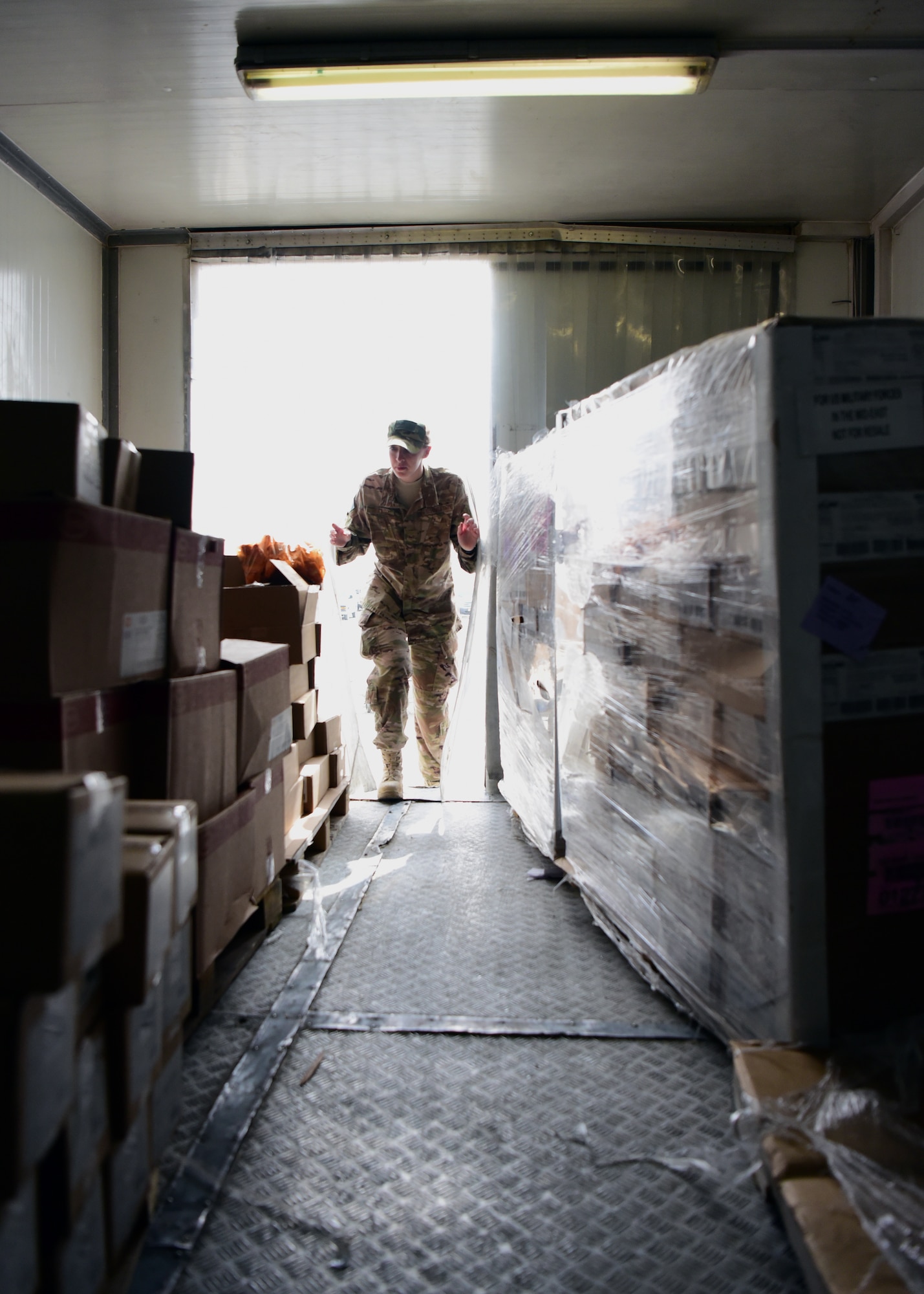 Staff Sgt. Laura Ibanez, 386th Expeditionary Medical Group public health technician, enters an outdoor walk-in freezer while conducting a food-service walkthrough at an undisclosed location in Southwest Asia, May 30, 2018. As a public health technician, Ibanez and her fellow Airmen inspect food product, services and facilities here at ‘The Rock’ for health compliance. Ibanez will soon be making the transition from enlisted to officer as she was recently selected for the Nurse Enlisted Commissioning Program for 2018. (U.S. Air Force photo by Staff Sgt. Christopher Stoltz)