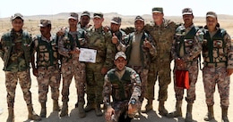Soldiers with the 11th Battalion, Jordan Armed Forces celebrate their graduation from the Jordan Operational Engagement Program after their formal graduation ceremony on April 29, 2018. Soldiers with the 1st Battalion, 184th Infantry Regiment, 2nd Armored Combat Team, Task Force Spartan, worked in unison with the Jordan soldiers to improve their communication and improve the interoperability between the two countries.