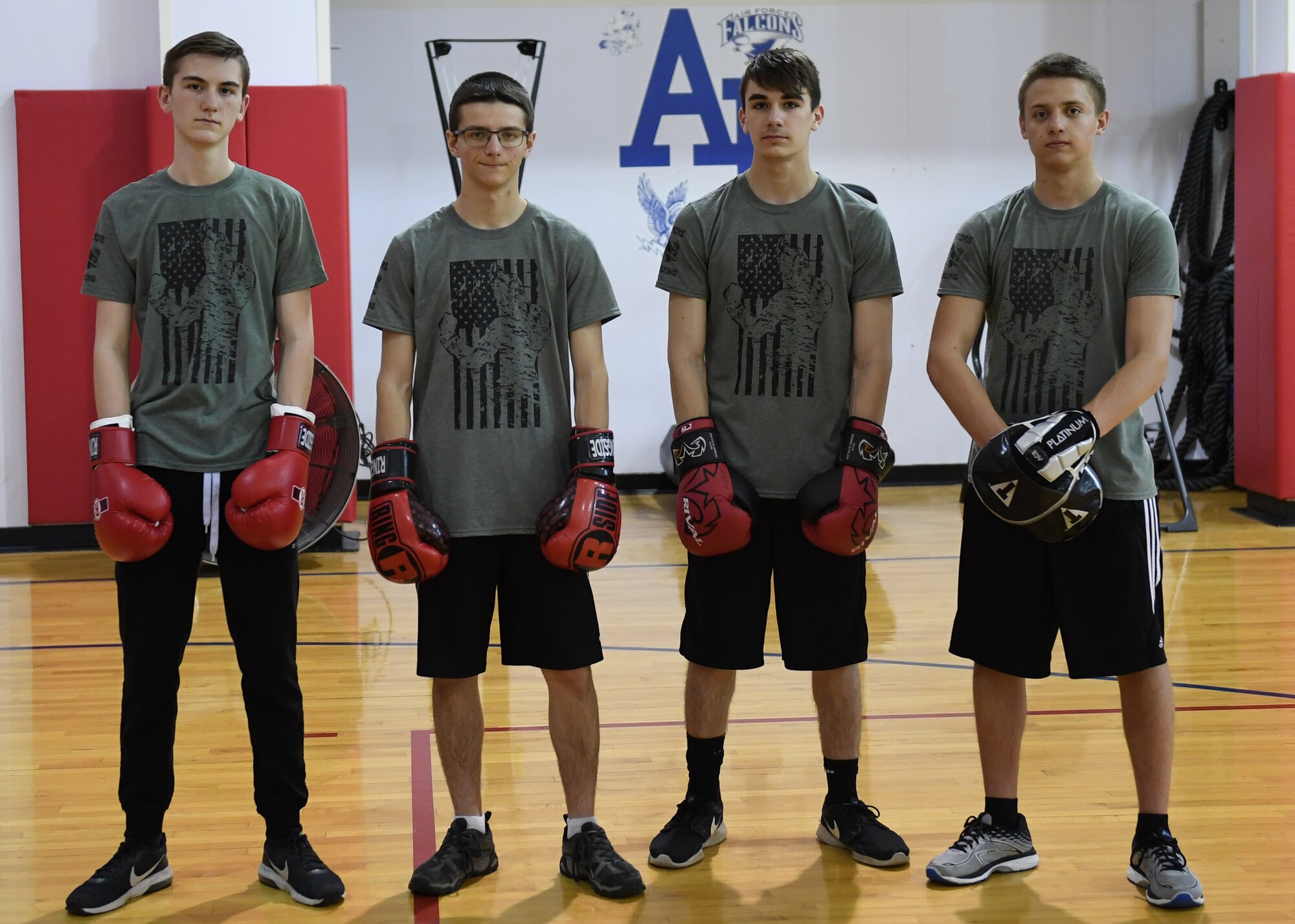 Ethan Conrad, student at Ambridge Area Junior High School in Freedom, Pa, Nathan Erickson, Nick Preza, and Logan Erickson, students at Ambridge Area Senior High School, in Ambridge, Pennsylvania, pose for a photo at the Fitness Center at Pittsburgh International Airport Air Reserve Station, Pennsylvania, May 5, 2018. These students are all Marine Corps Junior ROTC studnets at Ambrige Area Senior High School and are part of the Warriors' Call Boxing Club in Braeden, PA. (U.S. Air Force Photo by Airman 1st Class Grace Thomson)