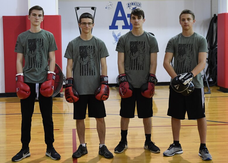 Ethan Conrad, student at Ambridge Area Junior High School in Freedom, Pa, Nathan Erickson, Nick Preza, and Logan Erickson, students at Ambridge Area Senior High School, in Ambridge, Pennsylvania, pose for a photo at the Fitness Center at Pittsburgh International Airport Air Reserve Station, Pennsylvania, May 5, 2018. These students are all Marine Corps Junior ROTC studnets at Ambrige Area Senior High School and are part of the Warriors' Call Boxing Club in Braeden, PA. (U.S. Air Force Photo by Airman 1st Class Grace Thomson)