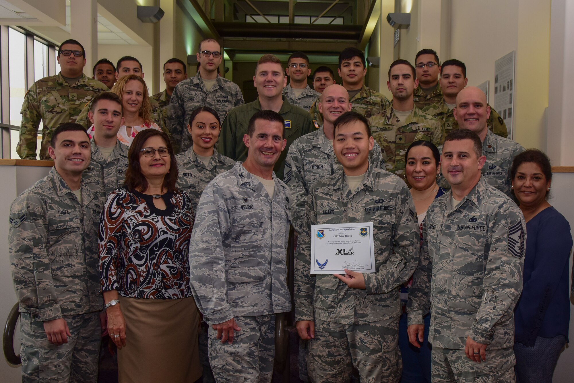 Airman 1st Class Brian Hoang, 47th Comptroller Squadron financial service technician, was chosen by wing leadership to be the “XLer” of the week, for the week of May 21, 2018, at Laughlin Air Force Base, Texas. The “XLer” award, presented by Col. Charlie Velino, 47th Flying Training Wing commander, is given to those who consistently make outstanding contributions to their unit and the Laughlin mission. (U.S. Air Force photo by Airman 1st Class Marco A. Gomez)