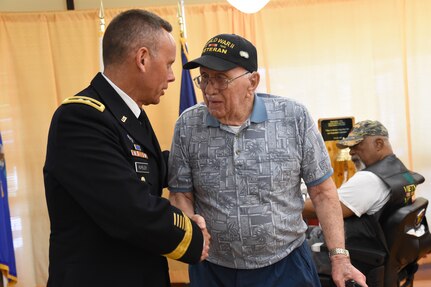 U.S. Army Maj. Gen. Daniel Karbler, U.S. Strategic Command chief of staff, greets a World War II veteran during the Eastern Nebraska Veterans’ Home Memorial Day ceremony, May 28, 2018, in Bellevue, Neb.