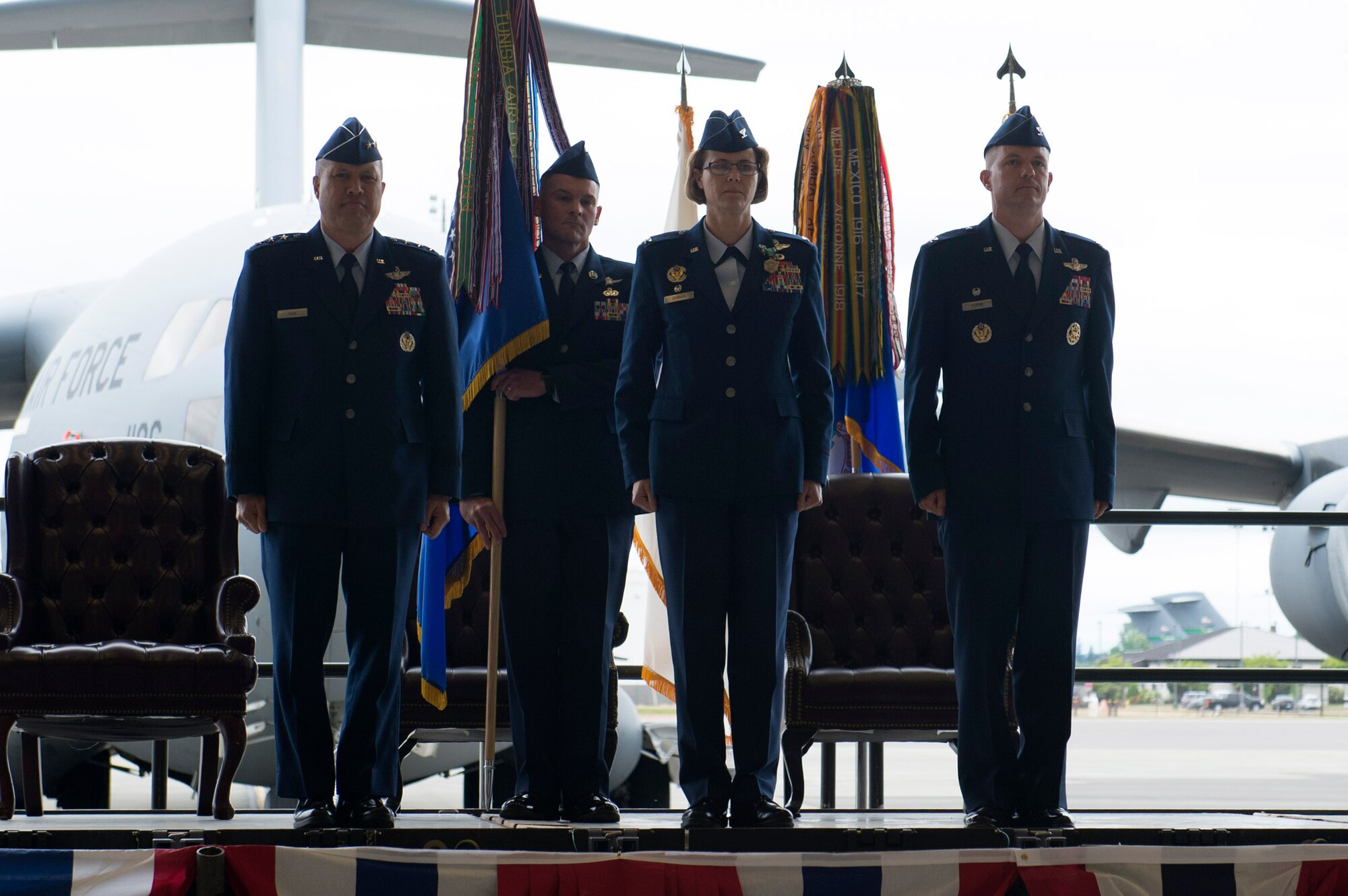From left, Lt. Gen. Giovanni Tuck, 18th Air Force commander, Chief Master Sgt. Jeffery Sandusky, 62nd Airlift Wing command chief, Col. Rebecca Sonkiss, 62 AW outgoing commander, and Col. Scovill Currin, 62 AW incoming commander, stand at attention during a change of command ceremony, May 24, 2018, Joint Base Lewis-McChord, Wash. Tuck presided over the ceremony. (U.S. Air Force photo by A1C Sara Hoerichs)