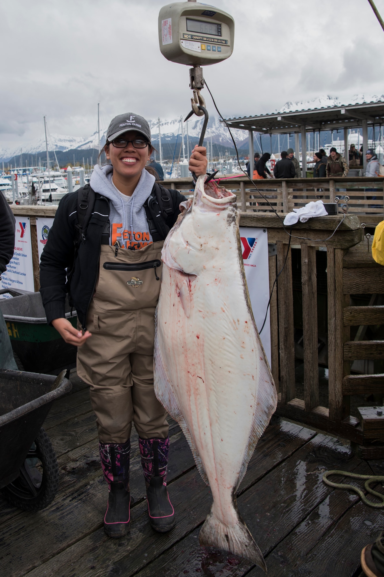 Airman 1st Class Kristie McGuire, a 673d IPTS aerospace medical technician, participates in the Armed Services YMCA of Alaska Combat Fishing Tournament in Seward, Alaska, May 24, 2018. McGuire caught the biggest fish on Puffin Fishing Charters’ team, weighing in at 66.8 pounds. This was McGuire’s first time deep-sea fishing. Founded in 2006, the tournament was established as a way of showing thanks and honor to service members through an opportunity to go deep-sea fishing.