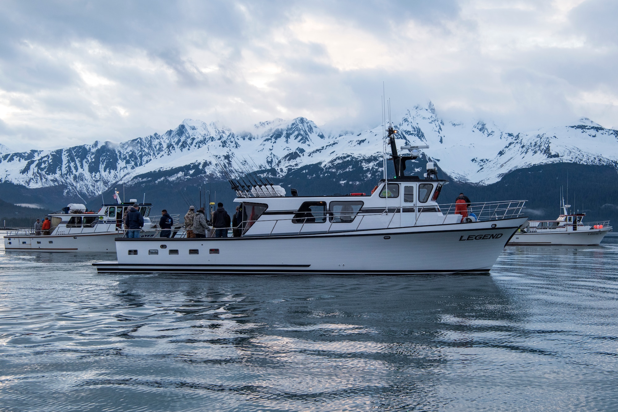 Charter boats line up in the harbor to prepare for the shotgun start during the 2018 Armed Services YMCA of Alaska Combat Fishing Tournament in Seward, Alaska, May 24, 2018. Founded in 2006, the tournament was established as a way of showing thanks and honor to service members through an opportunity to go deep-sea fishing. Because of community support and the volunteerism of the more than 660 crew members and 275 professional fishing charters supplying their time and services, more than 2,400 currently serving military personnel have been able to participate since its inception.